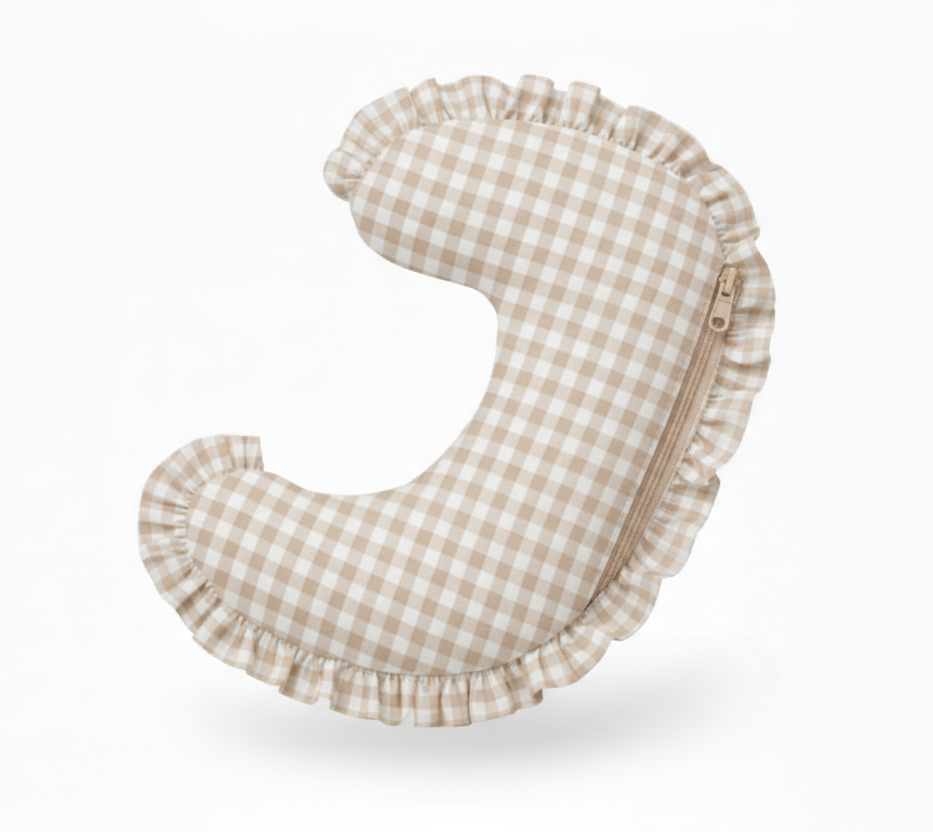 Checkered baby head support pillow on a white background