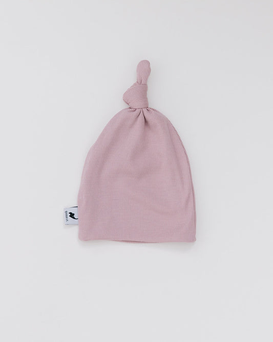 blush ribbed top knot hat
